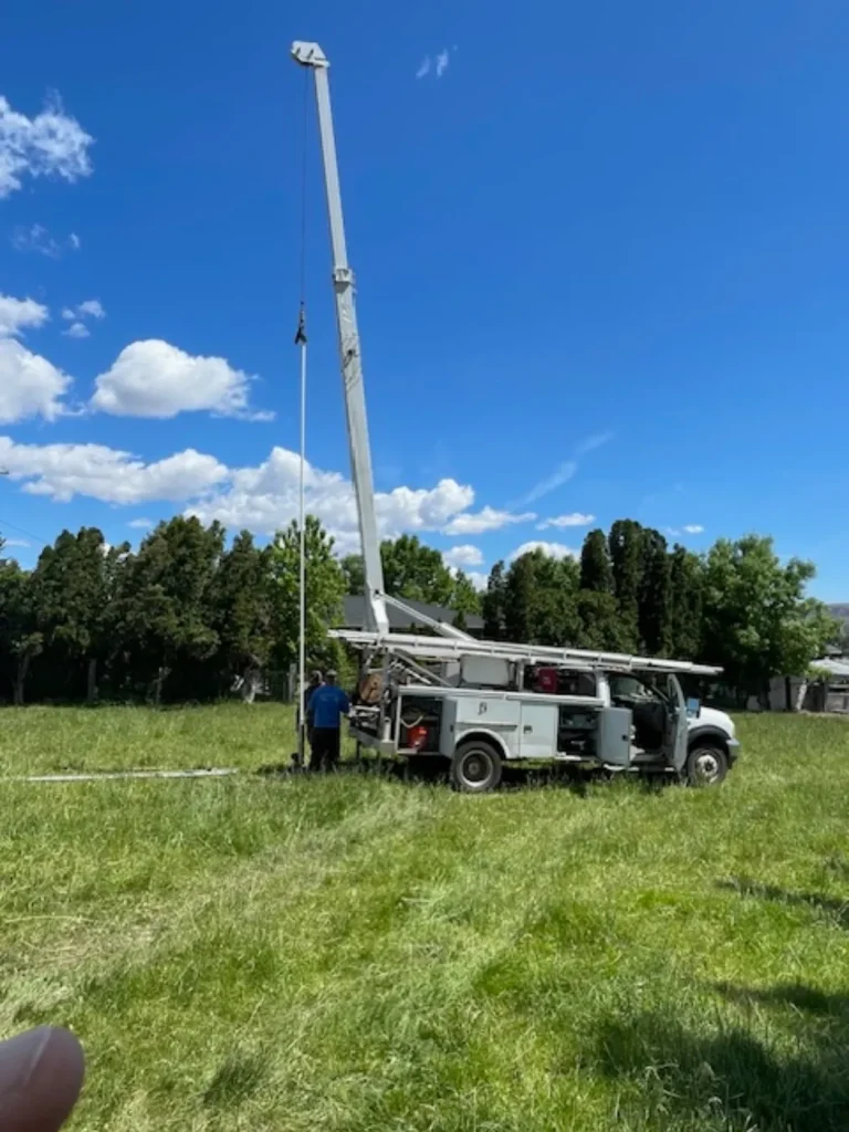 Crane truck in field