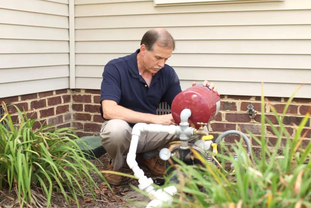 Man repairing residential well pump