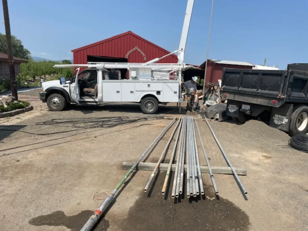 Well drilling with truck and pipes