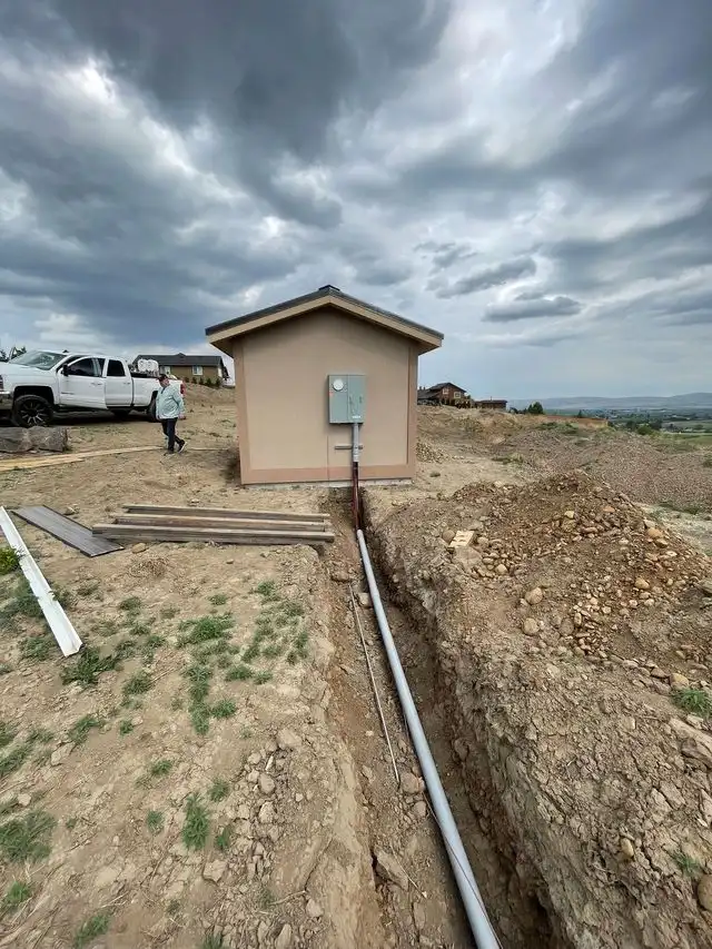 Pipe in a trench leading to a pump house