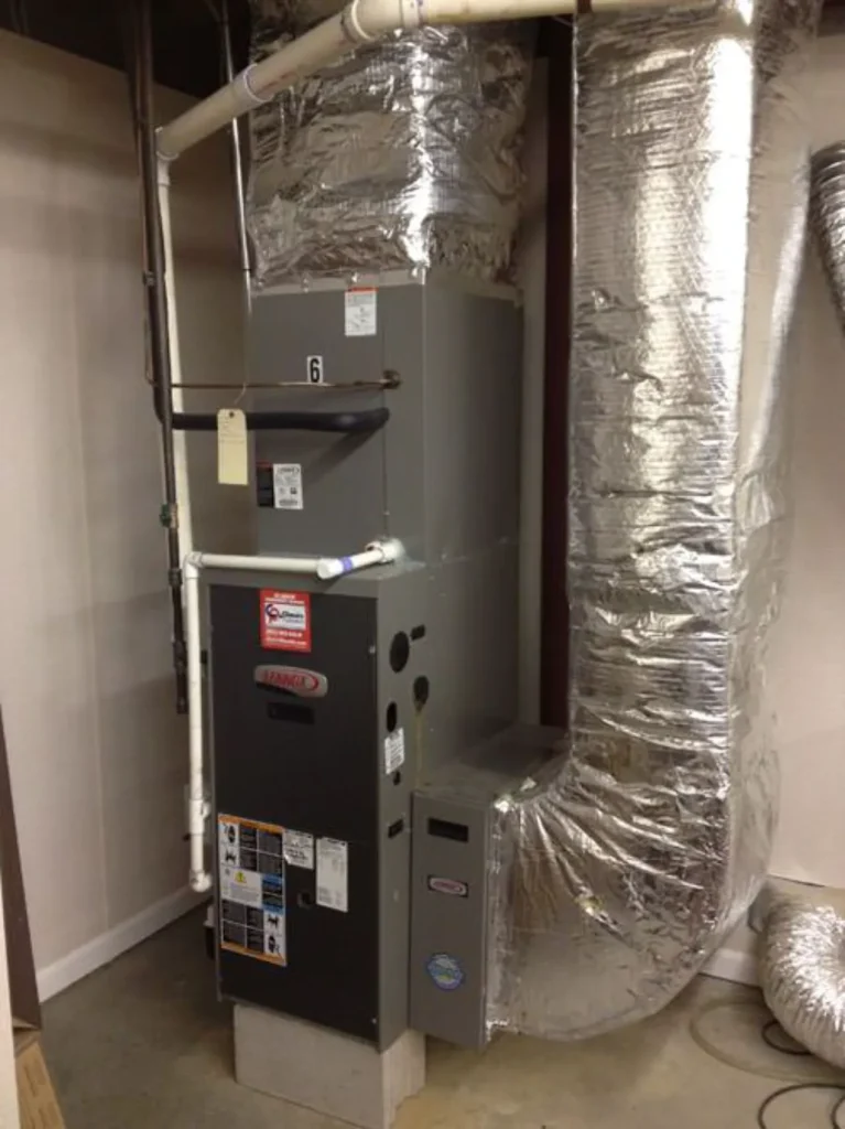 A basement furnace with insulated ductwork.